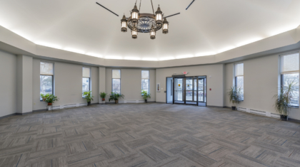 An interior photo of the new narthex, incorporating old lanterns from the historic church that were no longer in use