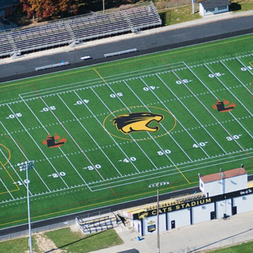 An aerial view of a football field construction project by Miller Diversified