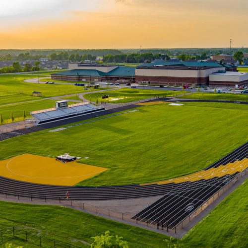 A sunset aerial view of the Perrysburg High School Track Commercial Construction Project