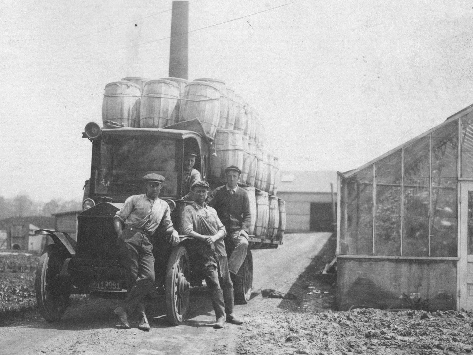 Miller-Diversified-History_0001_mfg-hauling-cukes-rep Four of the Miller Brothers are shown at Miller Farm & Greenhouse in Northwest Ohio sometime after the greenhouse was founded in 1920.